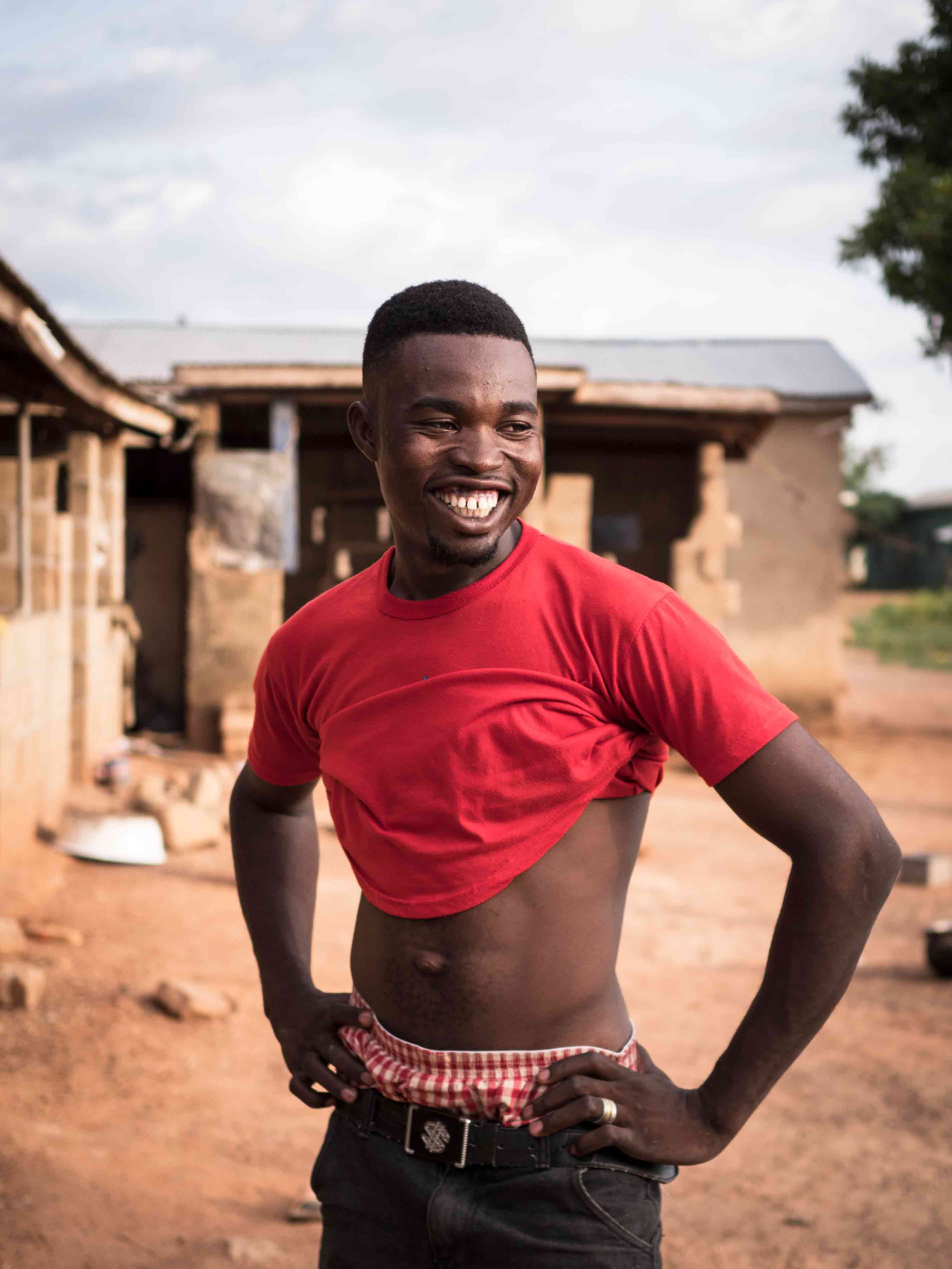 Man in red shirt, Ghana